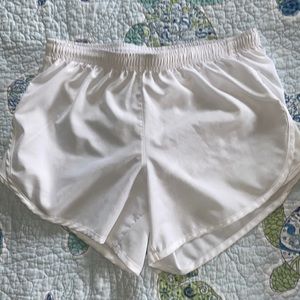 White Nike Dri-Fit running shorts.